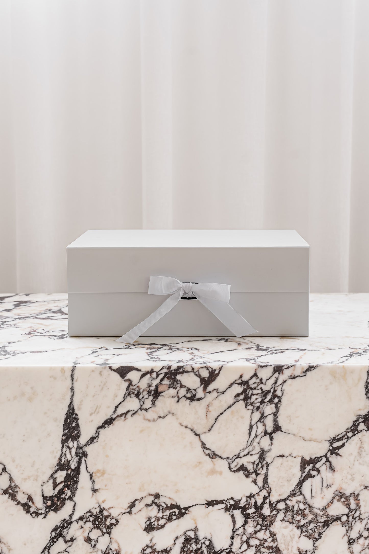 White magnetic gift box with ribbon by Unbox Me