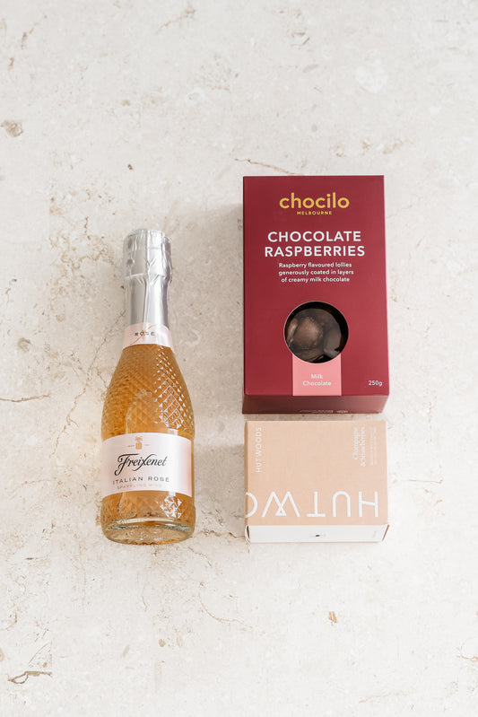 Freixenet Italian Rosé, Chocilo Chocolate Raspberries and Hutwoods candle included in The Rosé & Relaxation Box.