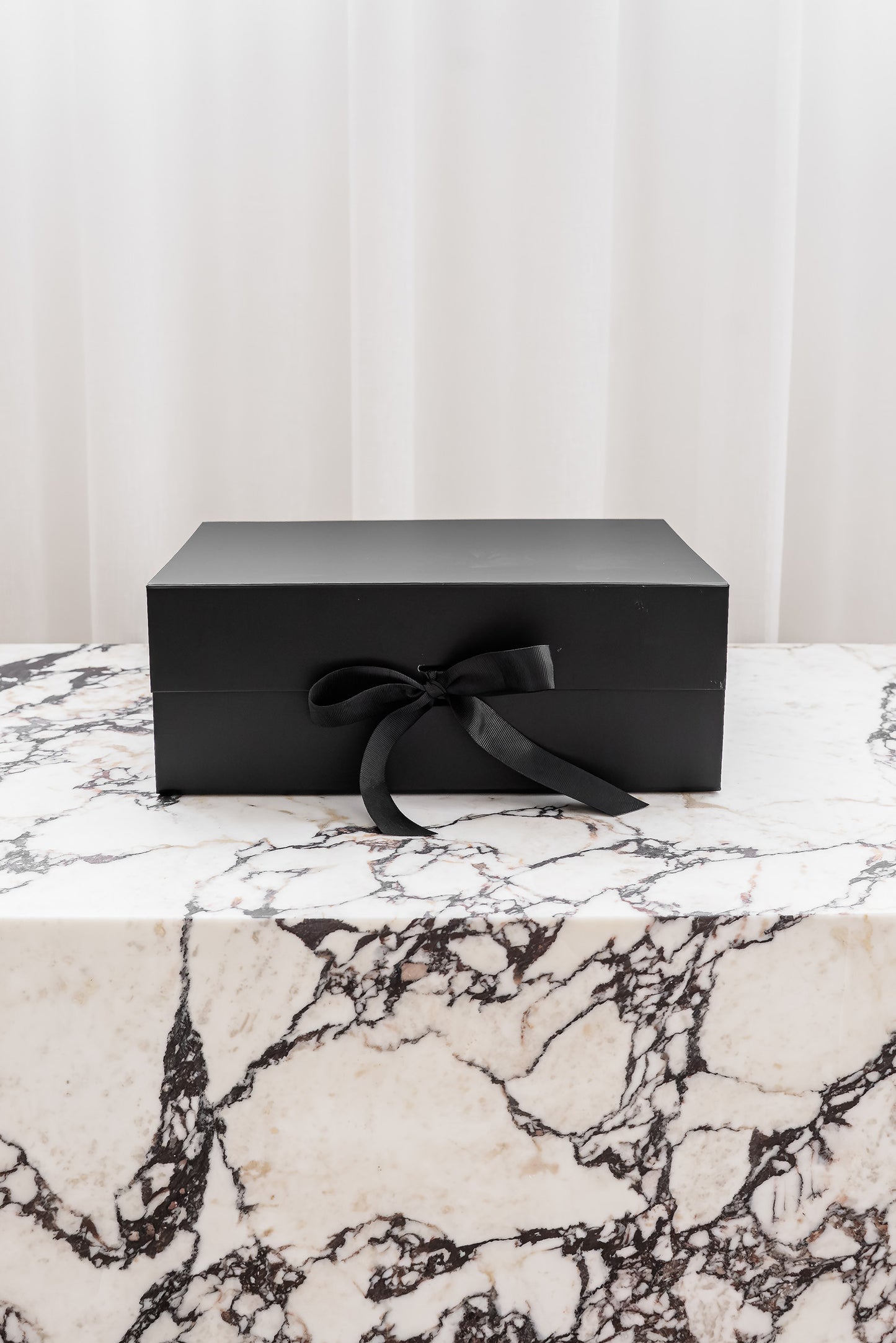 Black magnetic gift box with ribbon by Unbox Me