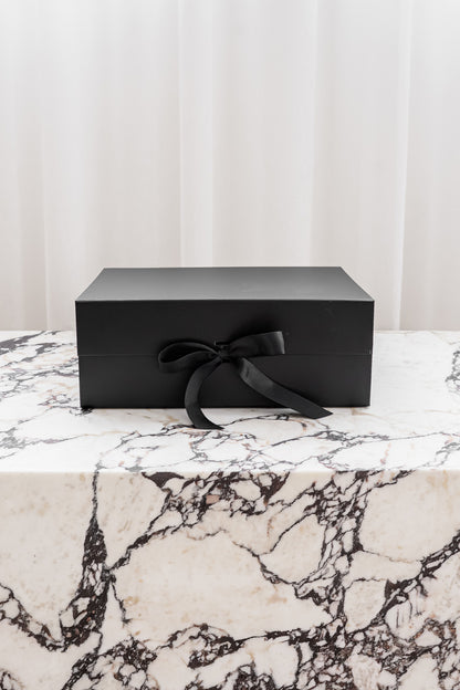 Black magnetic gift box with ribbon by Unbox Me