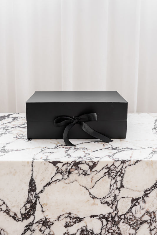 Black magnetic gift box with ribbon by Unbox Me